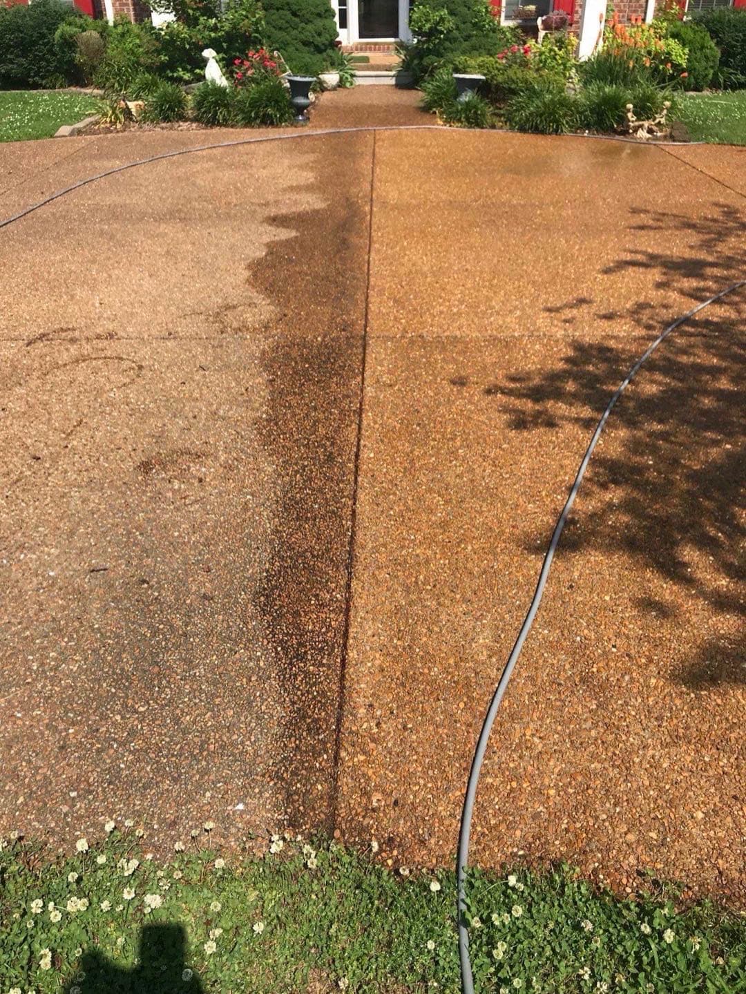 Before and after concrete driveway pressure washing in Brentwood, TN showing dramatic half-cleaned split view