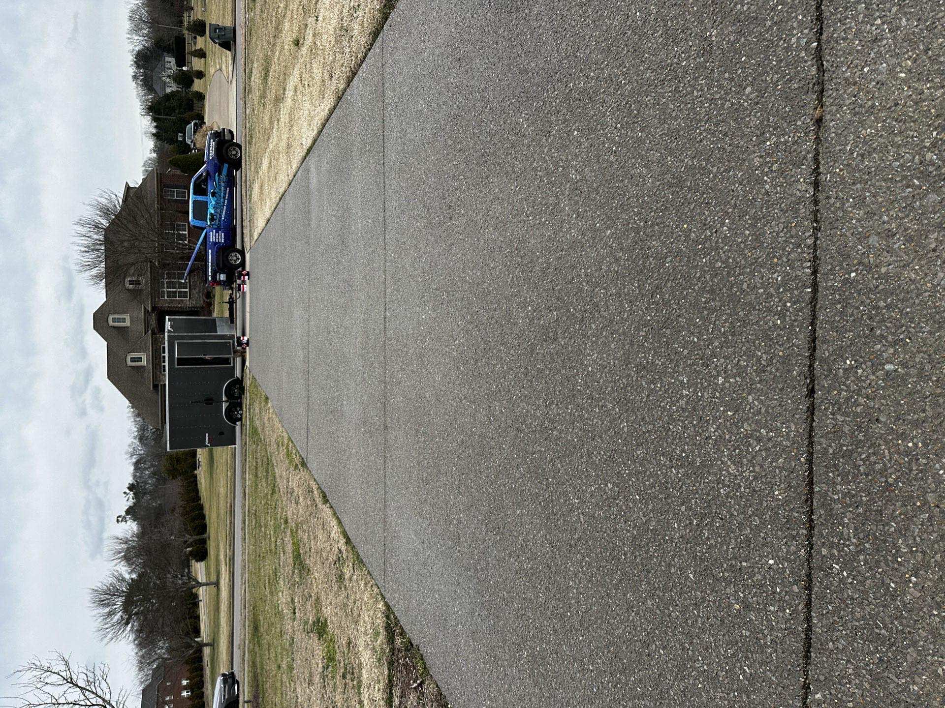 Long sealed driveway after professional concrete sealing service in Nashville, TN